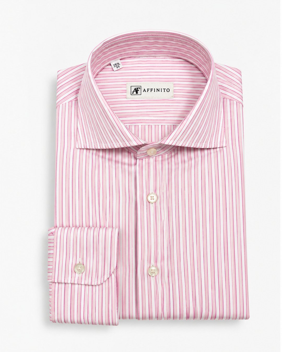 Camicia regular fit in cotone a righe rosa con collo francese Affinito, piegata su fondo bianco